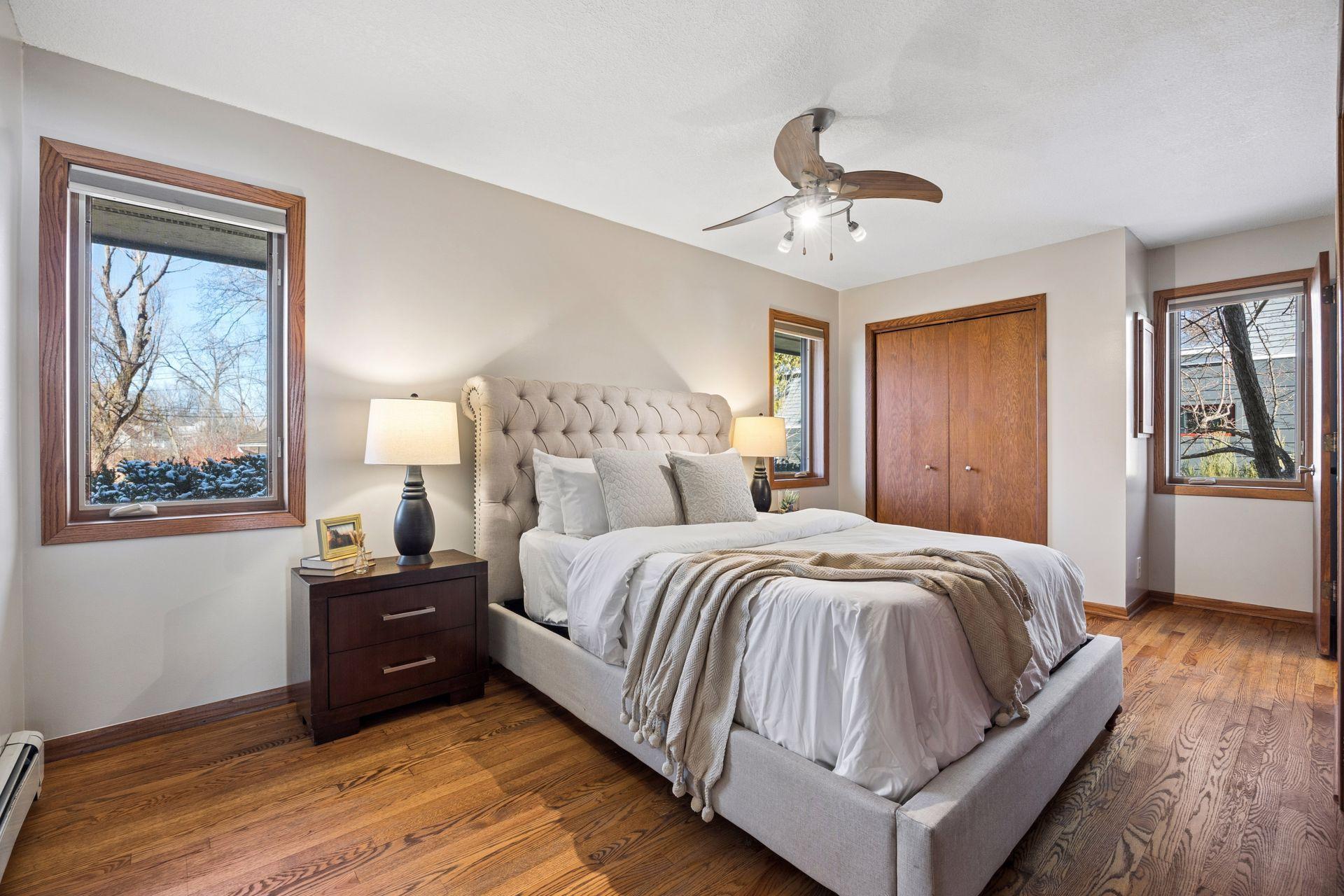 Spacious primary bedroom with dual closets.