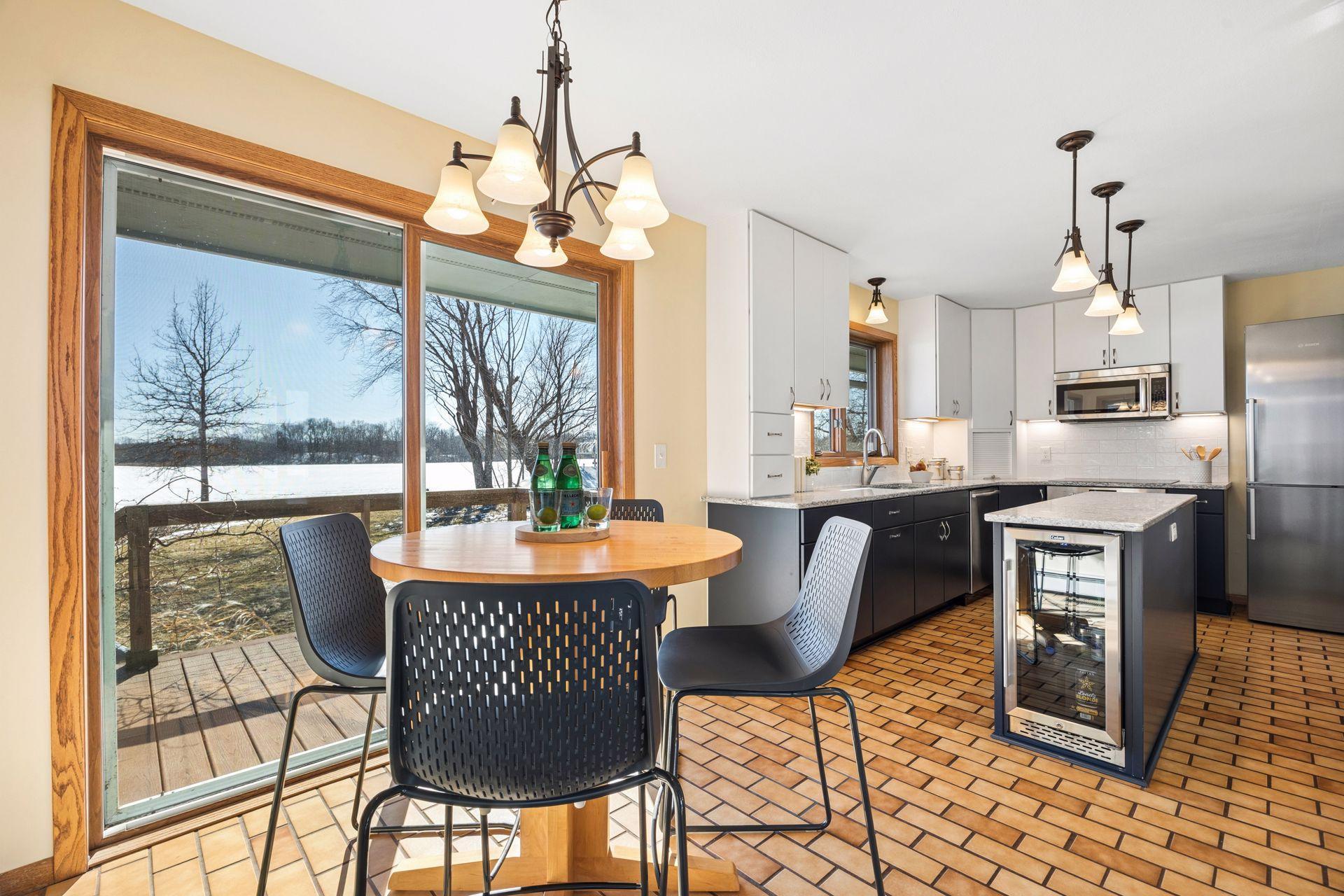 Eat-in kitchen with granite countertops and easy access to the deck.