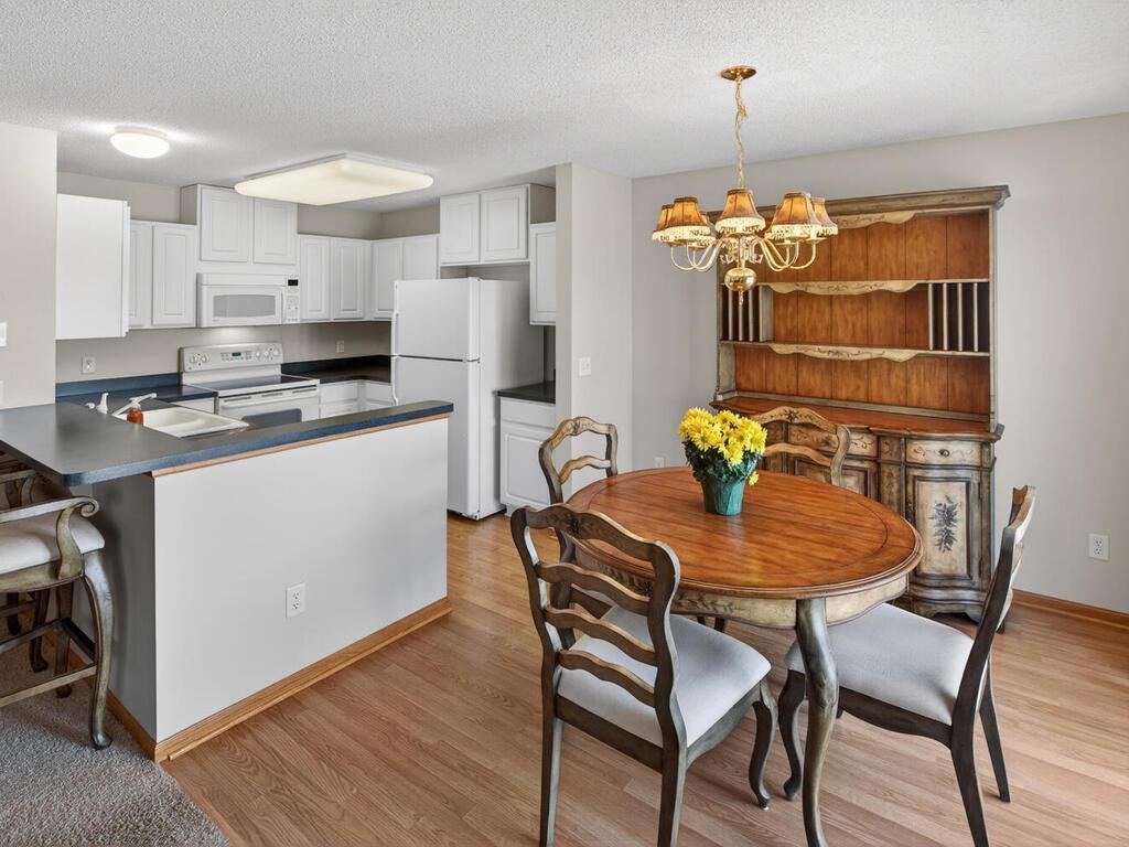 Dining and kitchen. Dining has patio doors leading to a new maintanence free deck.