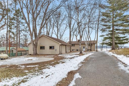Home is set deep into lot only feet from the lake
