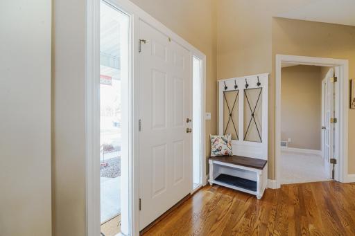Two full-view sidelights let natural light into the foyer.