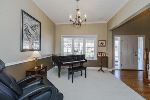 The living room (music room) has a new light fixture and crown molding!