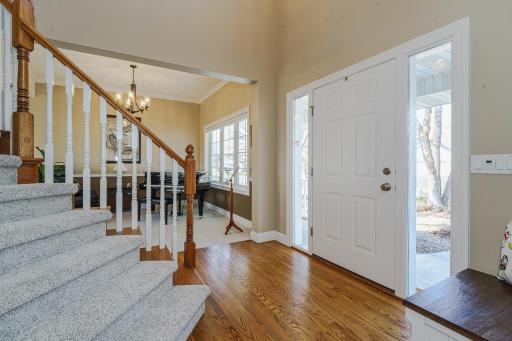Enter from the covered front porch into the main floor which has a functional open floor plan and comfortable room sizes! 3/4 hardwood flooring runs through most of this level.