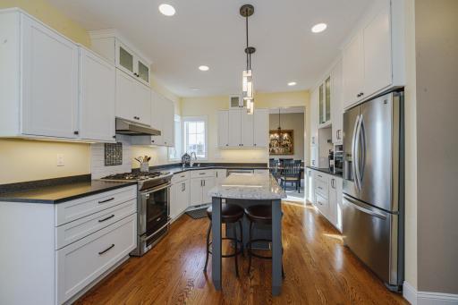 The kitchen recently underwent a to-the-studs remodel, including new cabinetry with staggered tops, soft-close drawers, and roll-out shelves! The kitchen has a youthful, fun and fresh vibe.