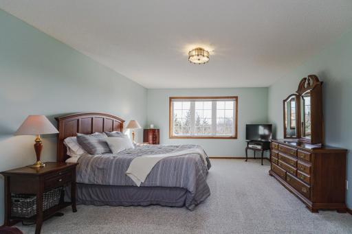 This room has a soothing paint color and updated lighting. All the bedrooms on the upper level have room-darkening shades.