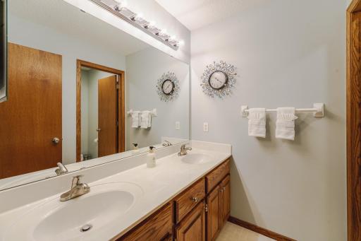 There is a full bathroom in the upper level hall, with dual sinks and the ability to close off the shower/commode area. The sink fixtures are new.