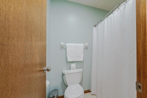 This bath has a private enclosure for the tub and toilet. The upper level hall bath has been freshly-painted.