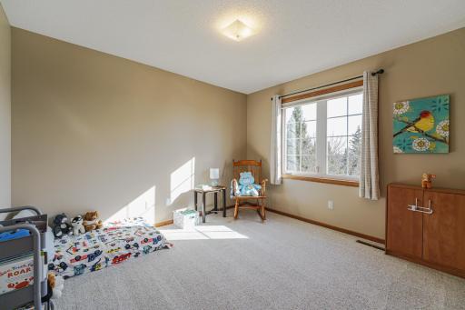 This is one of four upper level bedrooms. This room was freshly painted and overlooks the back of the home.