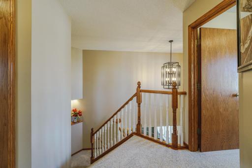 The stairwell has a lighted niche on the landing for evening ambiance.