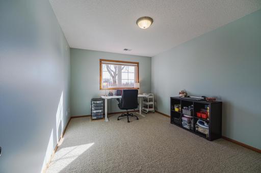The fifth bedroom is on the opposite end of the lower level from the family room, providing a sense of privacy for guests. This room has been freshly painted.