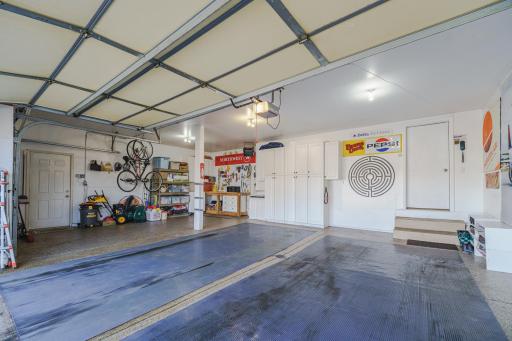 The attached garage cabinetry and workbench will stay. The unattached garage cabinets and unattached shelving will go with the seller.