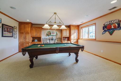 The billiard room also has maple built-ins and daylight windows.