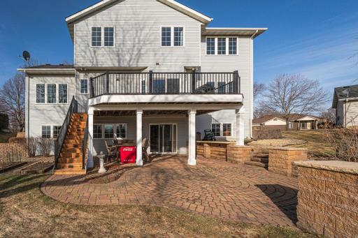 The back of the home has wonderful entertaining spaces with a 22x12 deck and a circular paver patio with retaining walls. There is room for your furnishings and fire pit, and more!