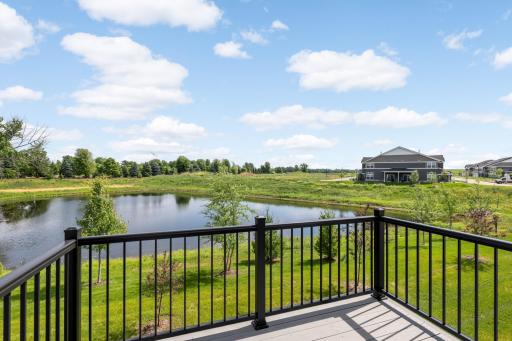 Enjoy peaceful pond views and open green space from the private deck.