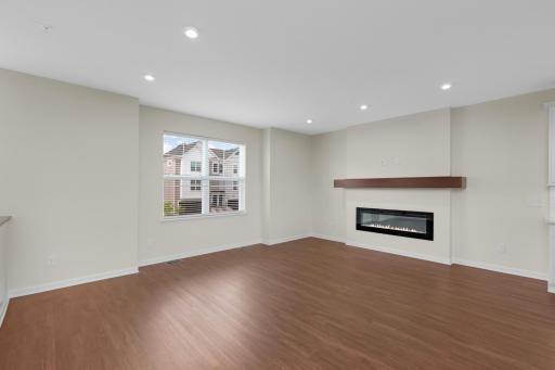 Contemporary linear gas fireplace creates a striking focal point in the Living Room.