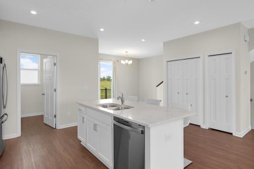 Large center island offers additional seating, prep space and storage.