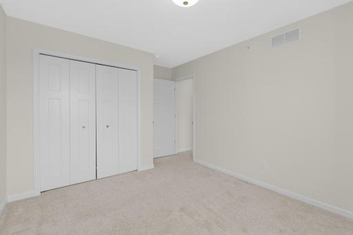 Fresh white trim work and panel doors throughout.