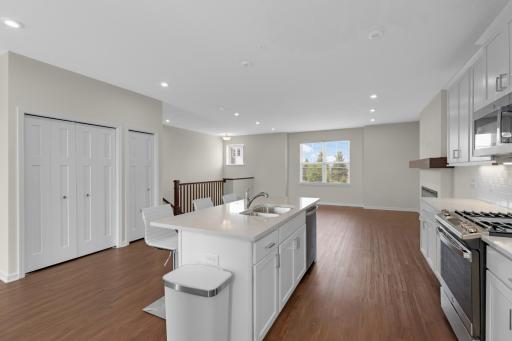 Open sightlines keep everyone connected whether cooking, dining or relaxing.