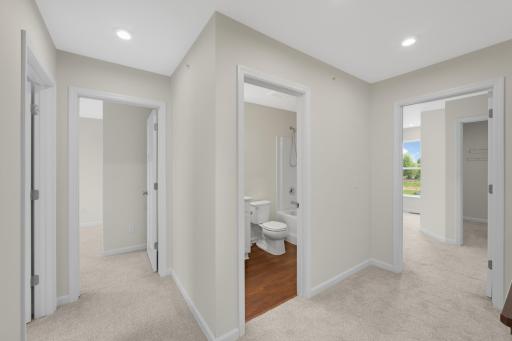 Upper-level hallway provides easy access to all bedrooms and the full bath.