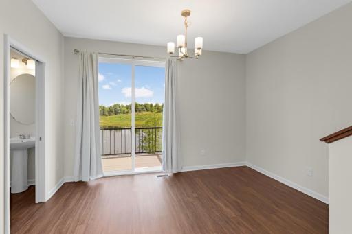 Prepare meals while enjoying views of the pond through the Dining Area patio door.