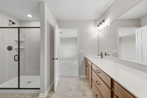 Owner bath with easy to clean shower surround