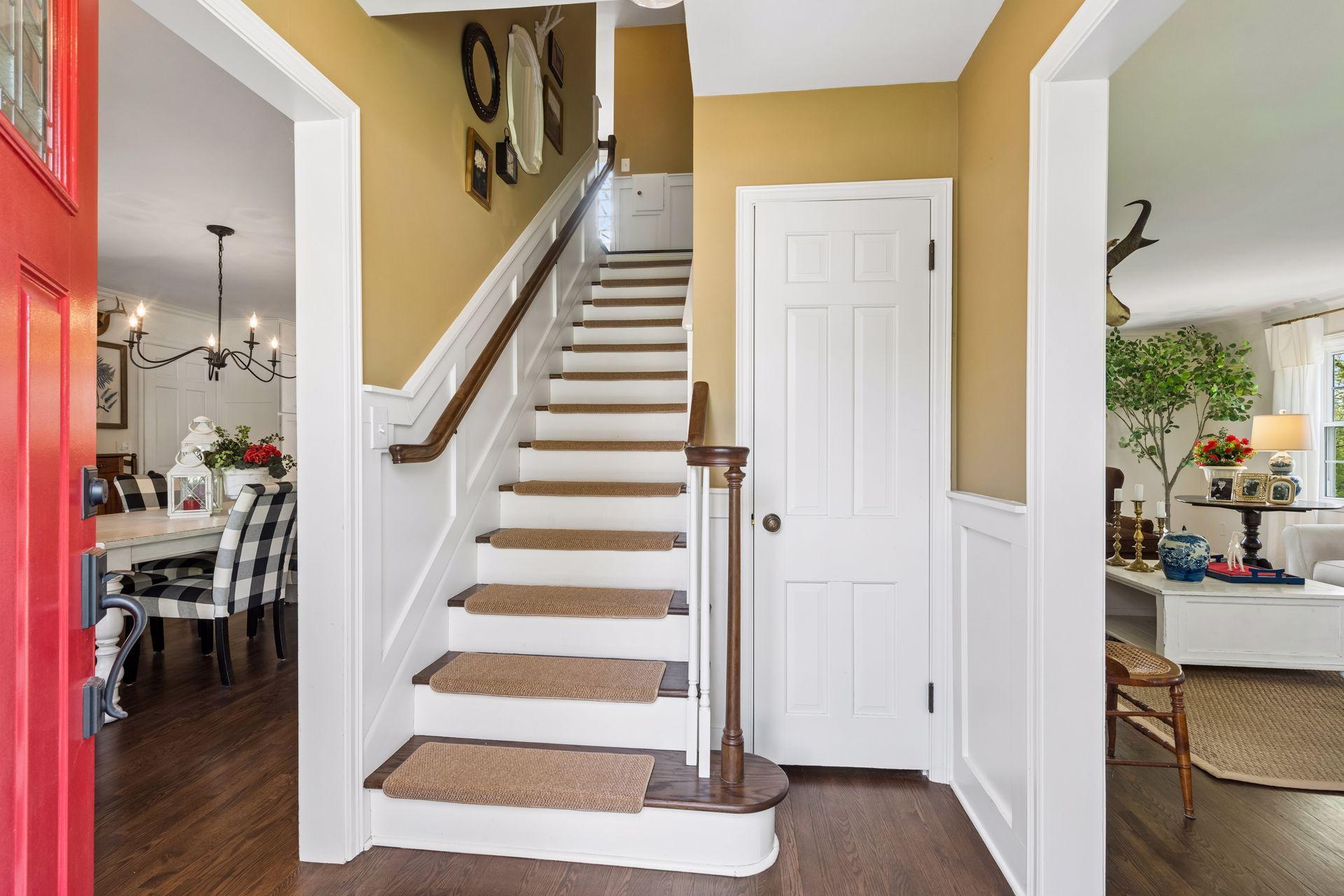 Statement staircase leads to the upper-level, where all 3 bedrooms are located