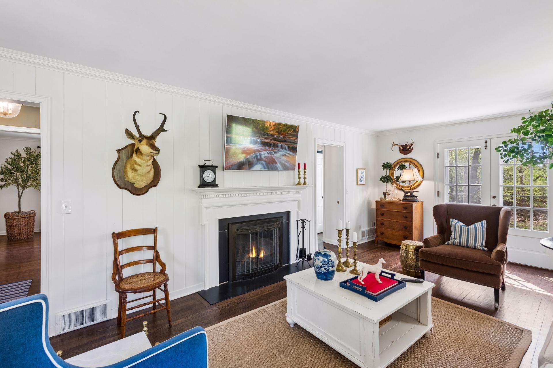 Gather with friends and family in the living room with gas-burning fireplace