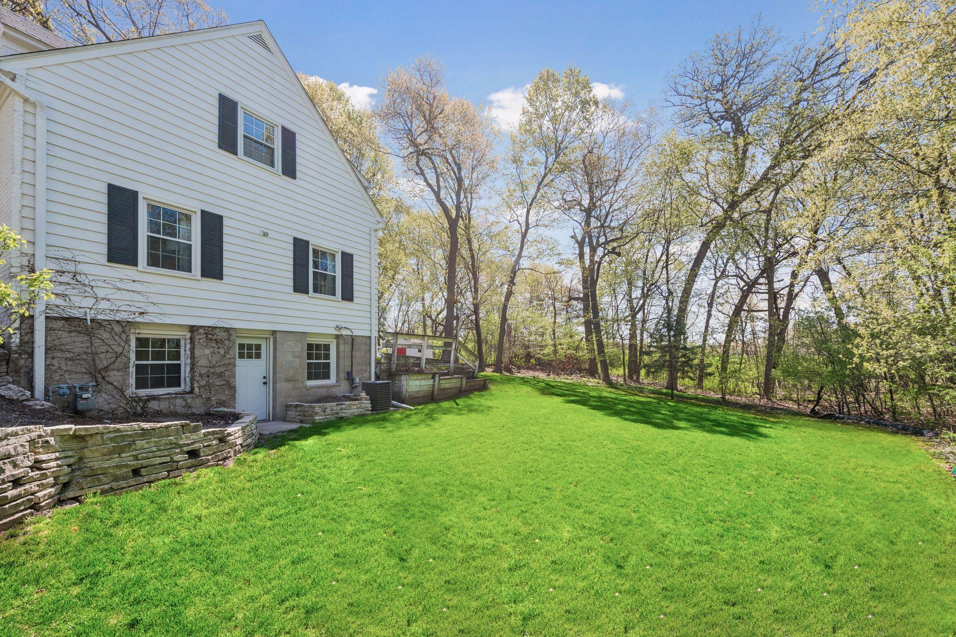 Spacious yard surrounded by mature trees