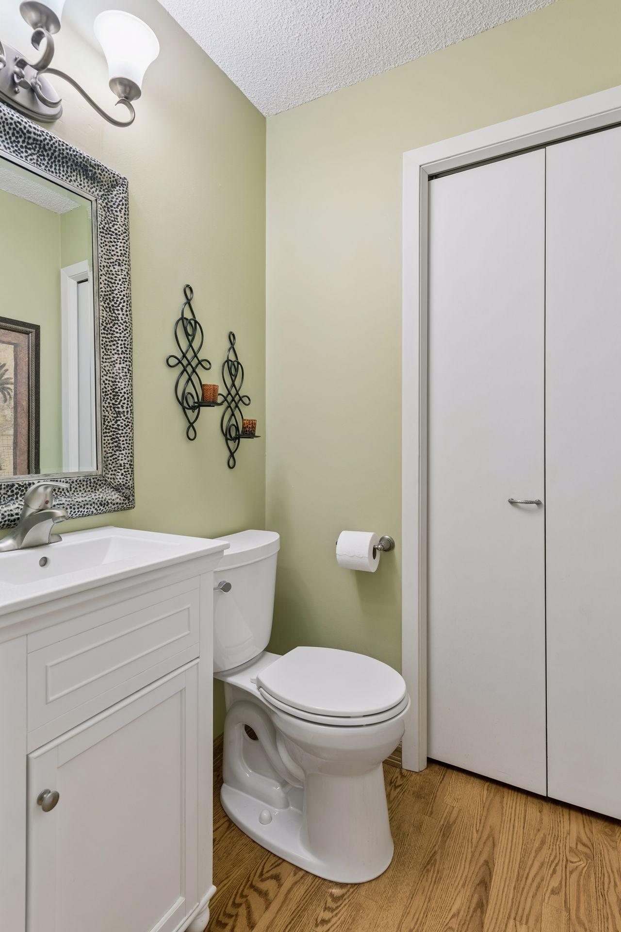 Updated main-level half bath with clean, neutral finishes.
