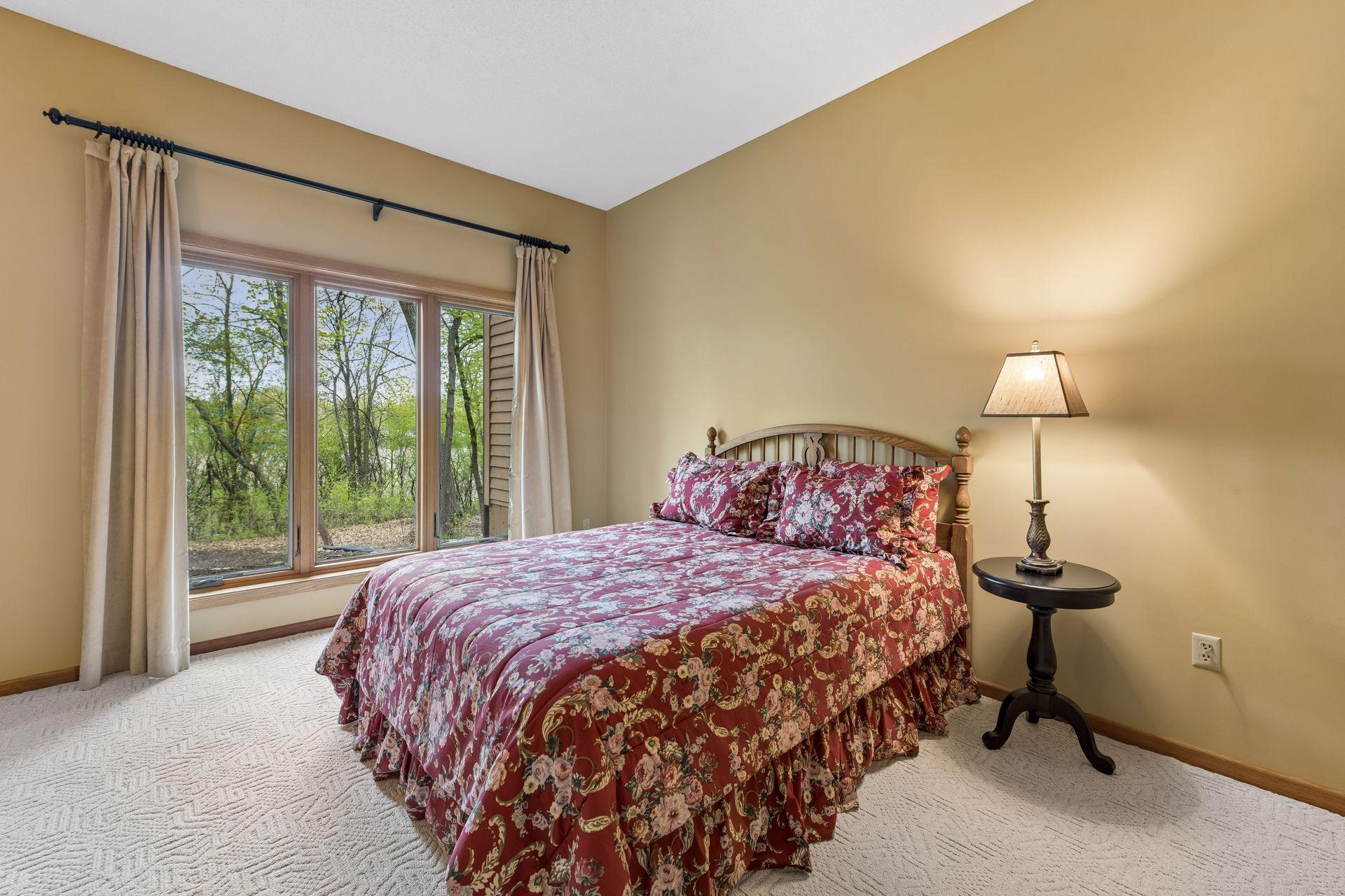 Another view of this spacious bedroom with backyard views. Both lower-level bedrooms have newer windows.