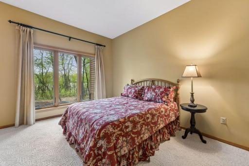 Another view of this spacious bedroom with backyard views. Both lower-level bedrooms have newer windows.