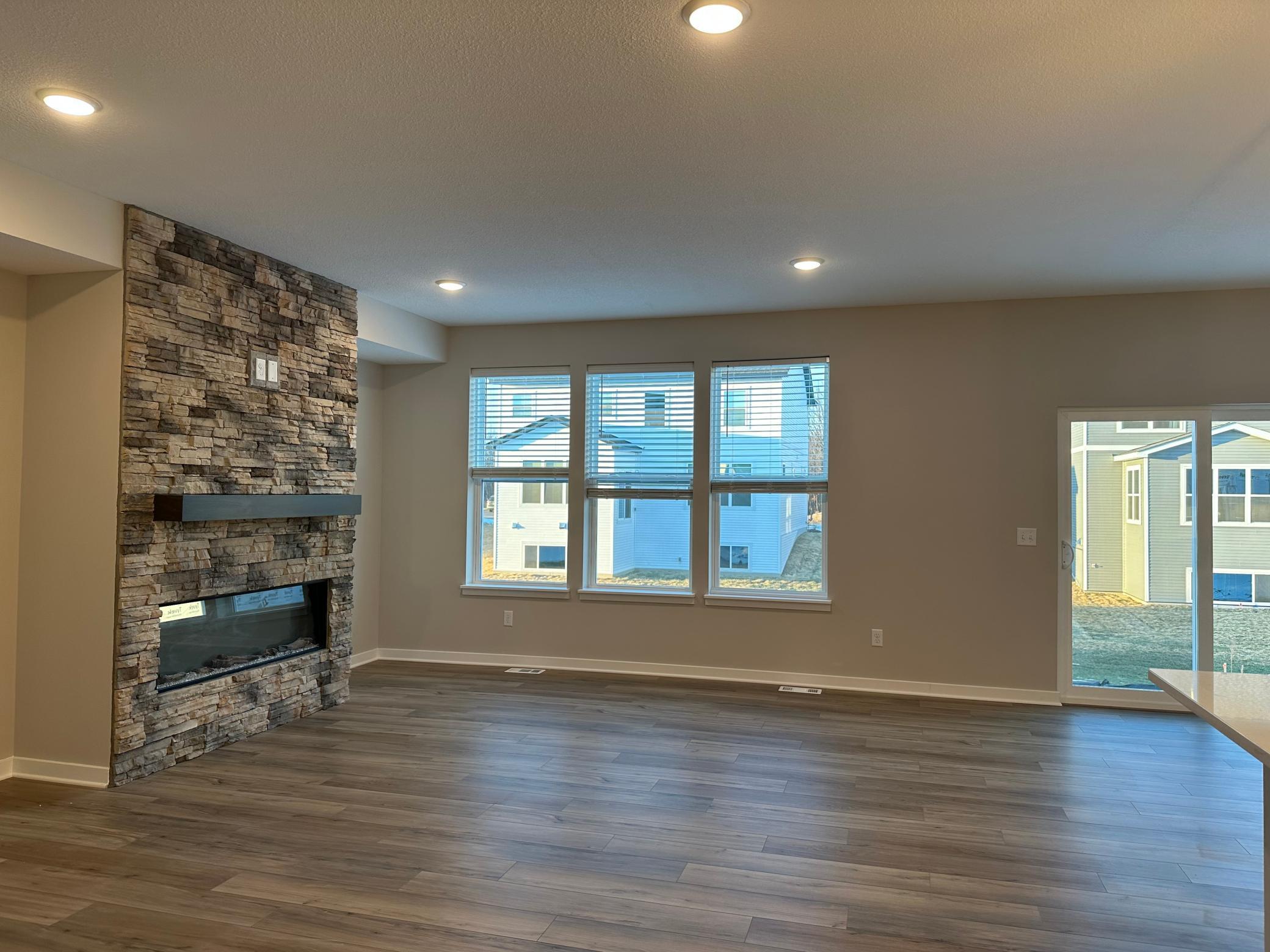 Gathering room with stone surround fireplace