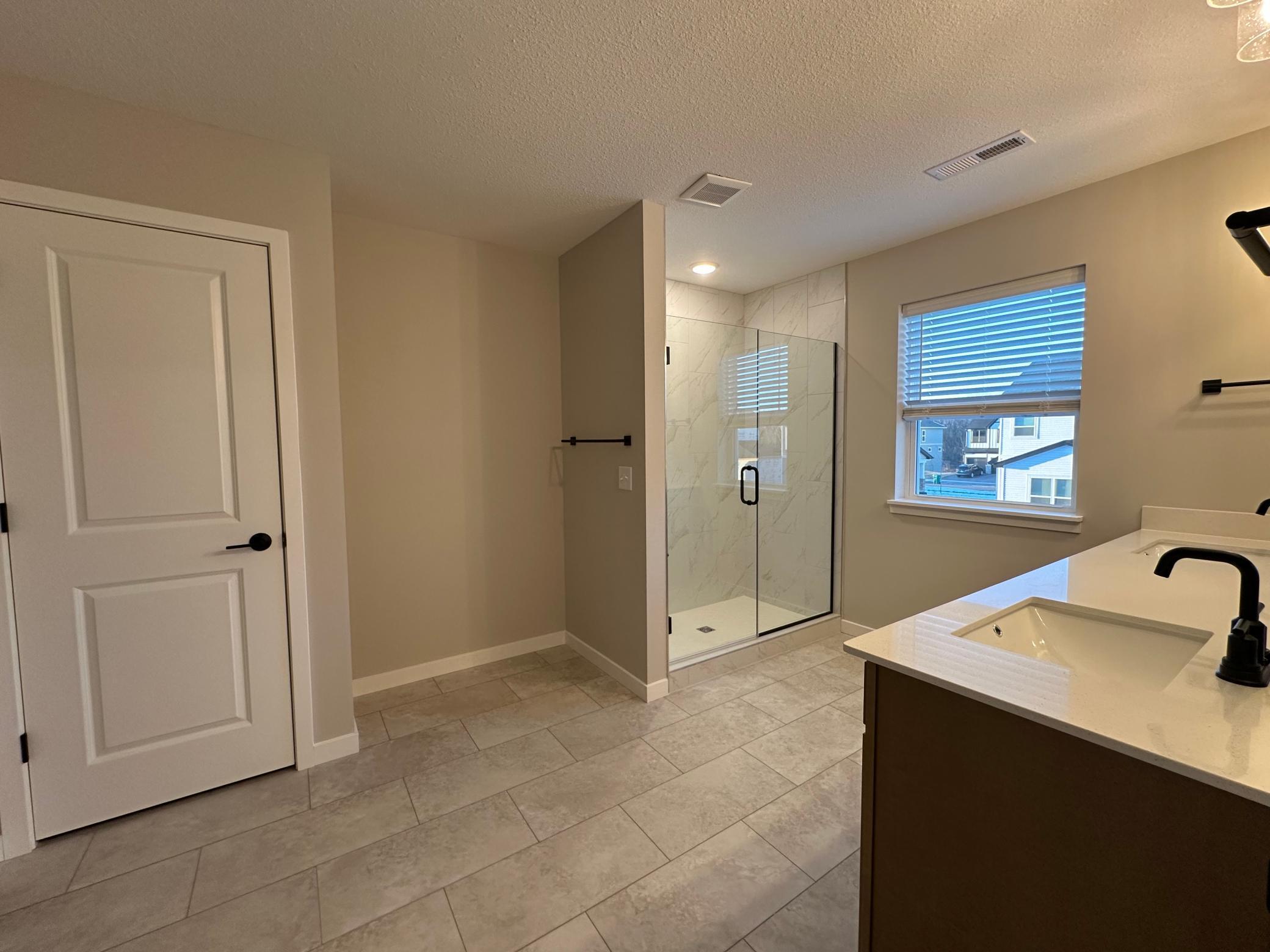 Primary bath with large walk in shower.