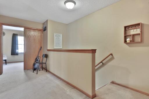 Upper level features two bedrooms and loft space.