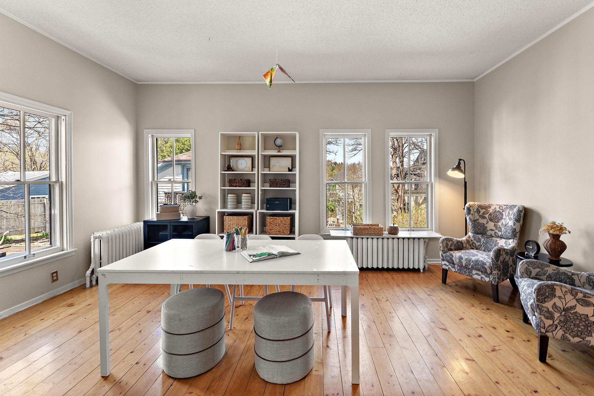 Another functional space on the main level, perfect for an office, playroom or second family room, adjacent to a second back stairway