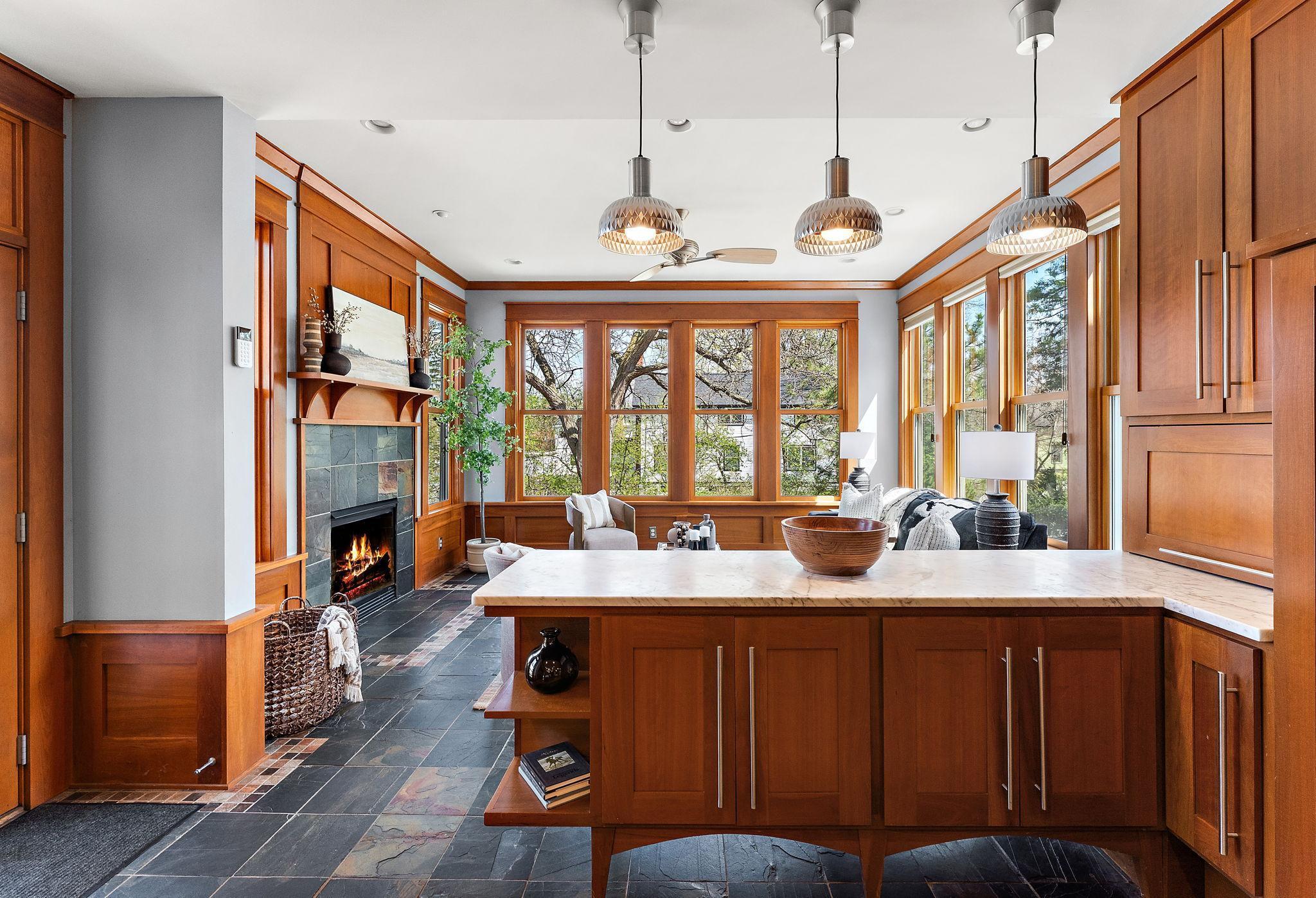 Custom woodwork and cabinetry in the matching center island and peninsula