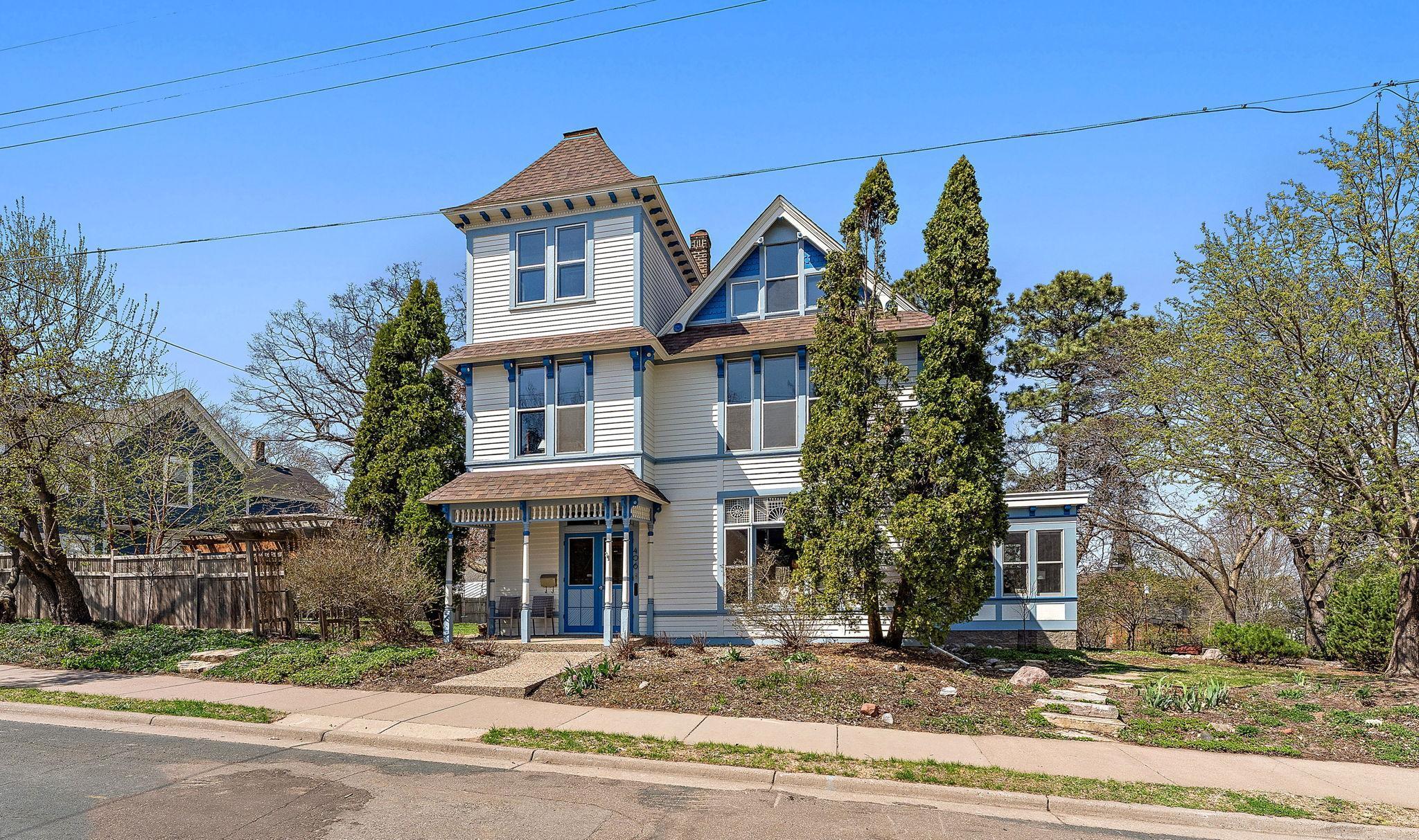 Professionally landscaped with garden beds, mature trees, perennials, garden paths and outdoor living spaces