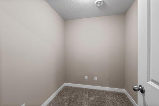 The upper level versatile bonus roomâperfect for a home office or additional living space.