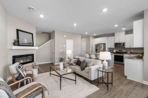 Another view of the living room, showcasing the nearby kitchen.