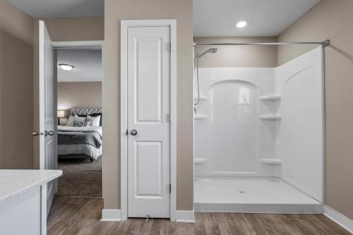 Alternate perspective of the 3/4 bathroom with a spacious walk-in shower.