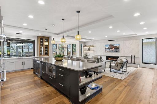 Built-in microwave & wine/beverage refrigerator. Engineered white oak wide plank flooring throughout the main level.