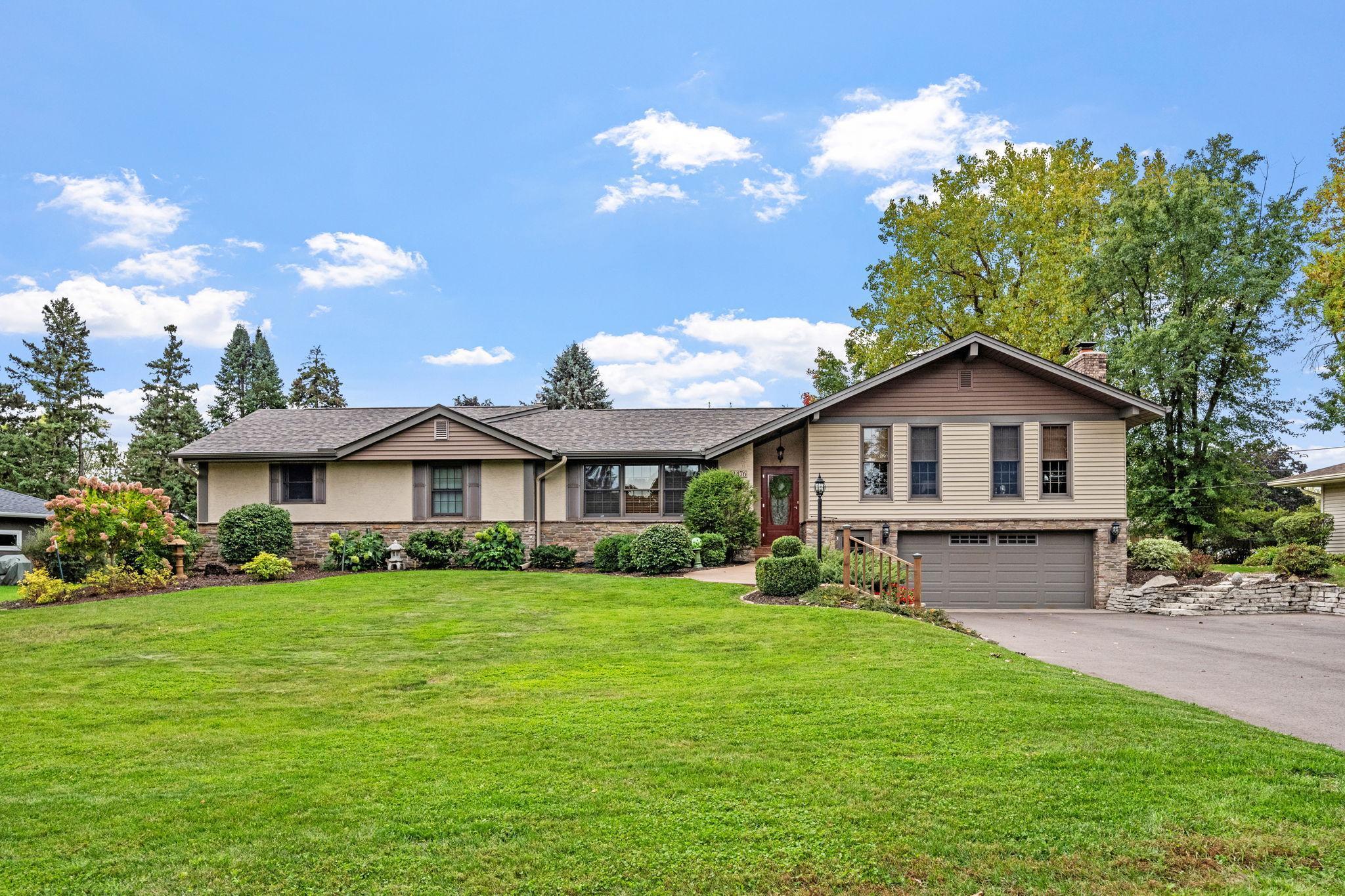 Exceptional curb appeal on this stone and stucco rambler with awesome great room addition which is sure to please for generations