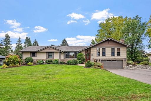Exceptional curb appeal on this stone and stucco rambler with awesome great room addition which is sure to please for generations