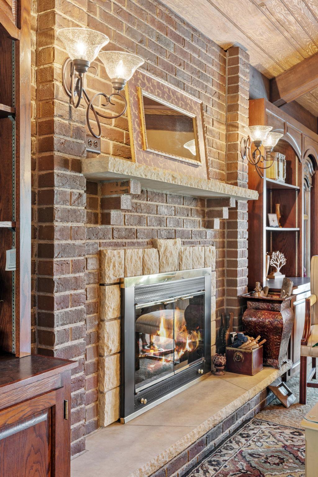 Brick & stone fireplace is a highlight feature