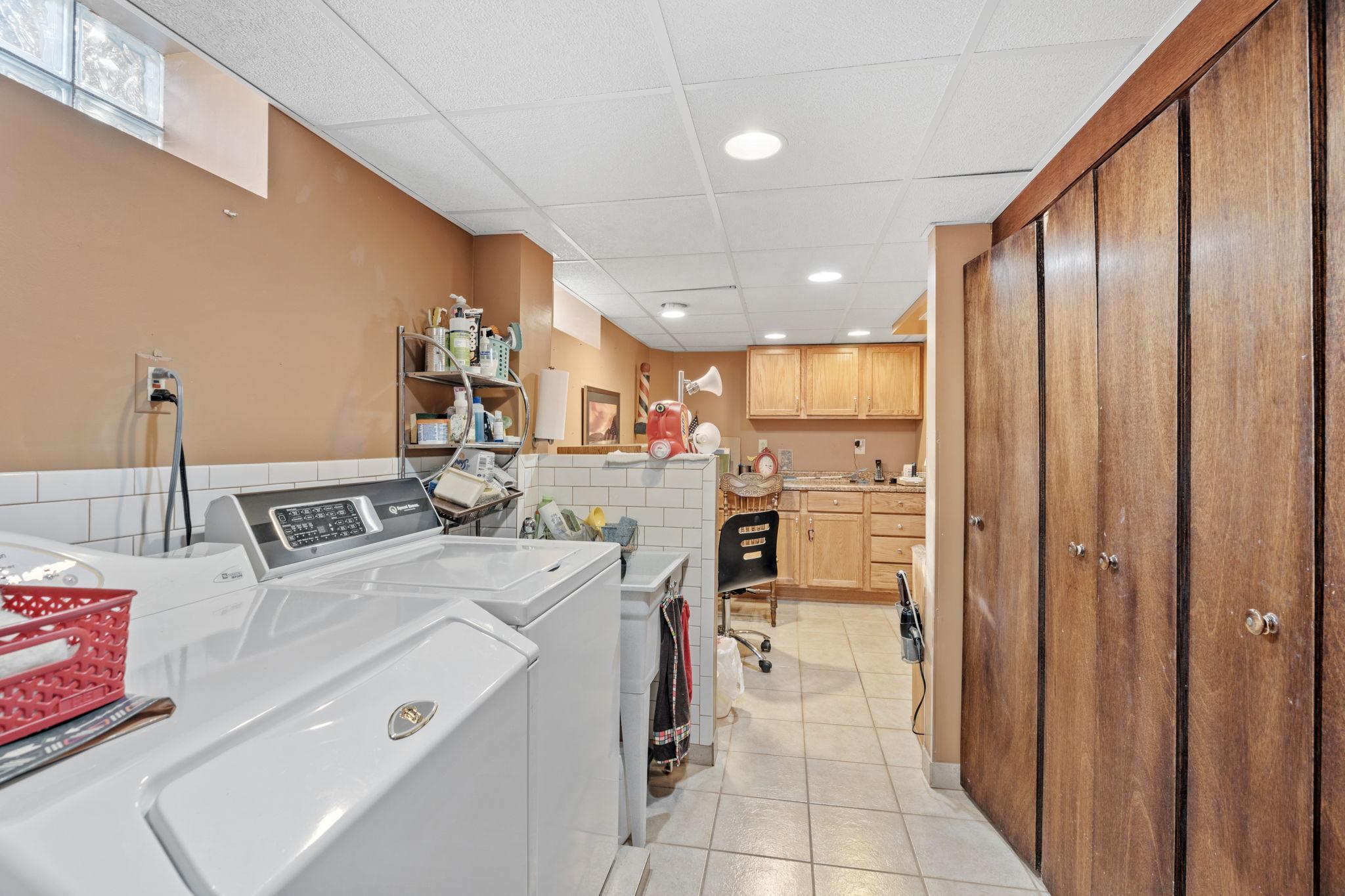 Weekly laundry is easy in clean finished laundry space