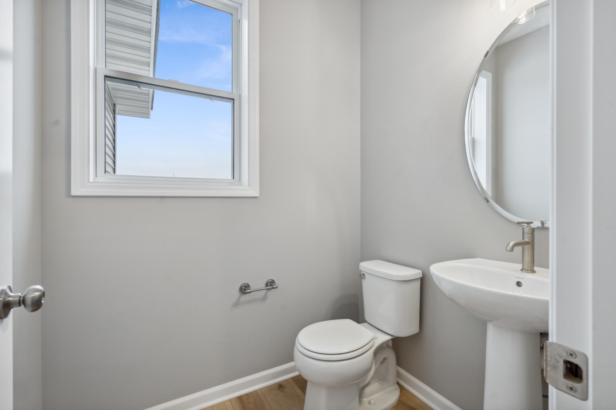 Main Level Bathroom *Photo of a previously built home of the same floor plan. Finishes/options may vary.