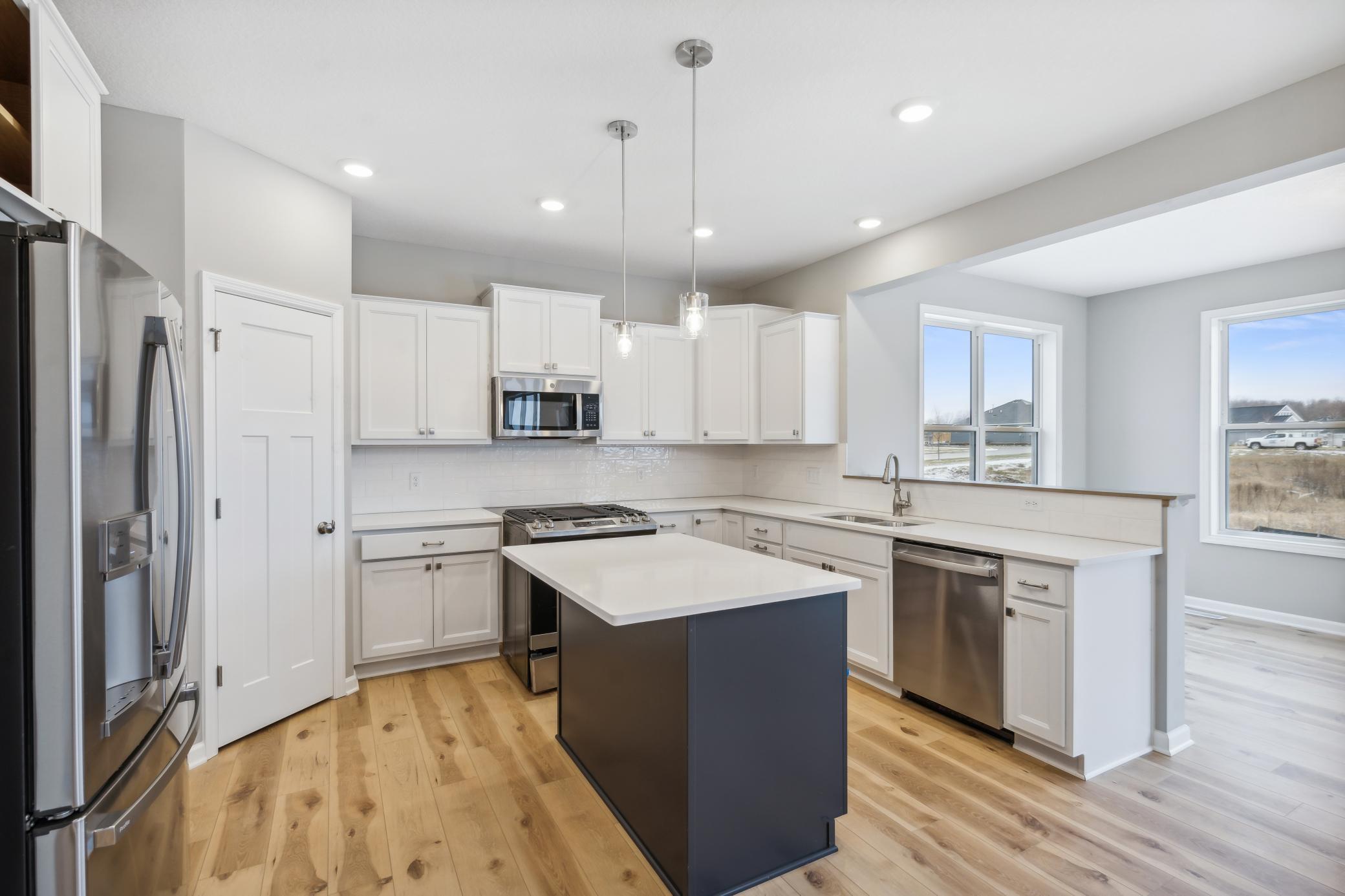 Kitchen *Photo of a previously built home of the same floor plan. Finishes/options may vary.