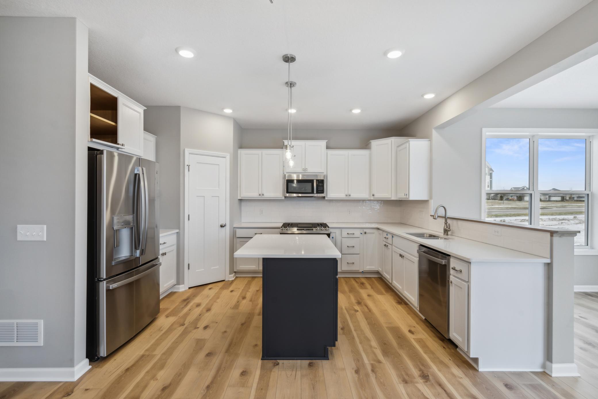 Kitchen *Photo of a previously built home of the same floor plan. Finishes/options may vary.
