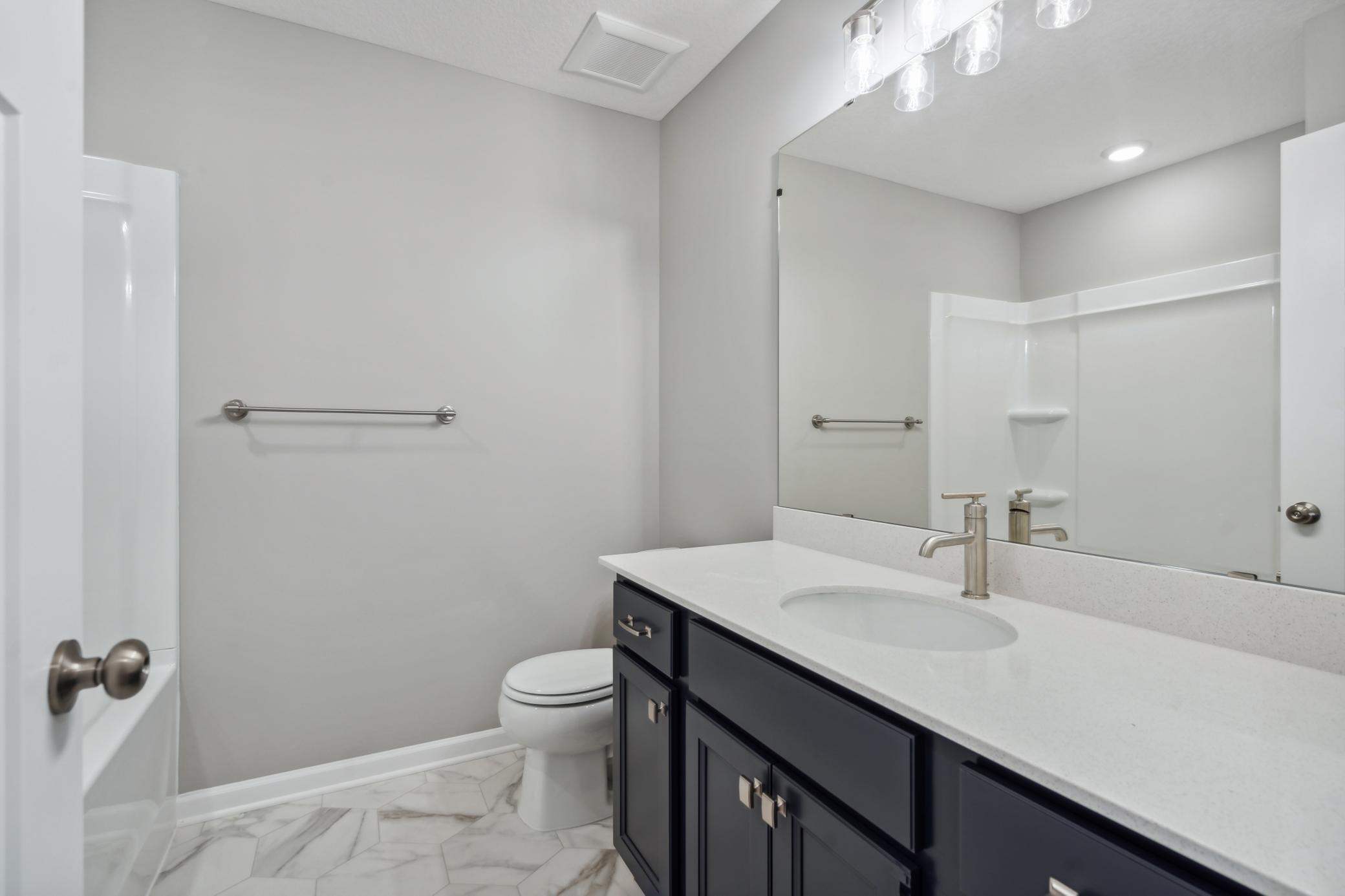 Upper Level Bathroom *Photo of a previously built home of the same floor plan. Finishes/options may vary.