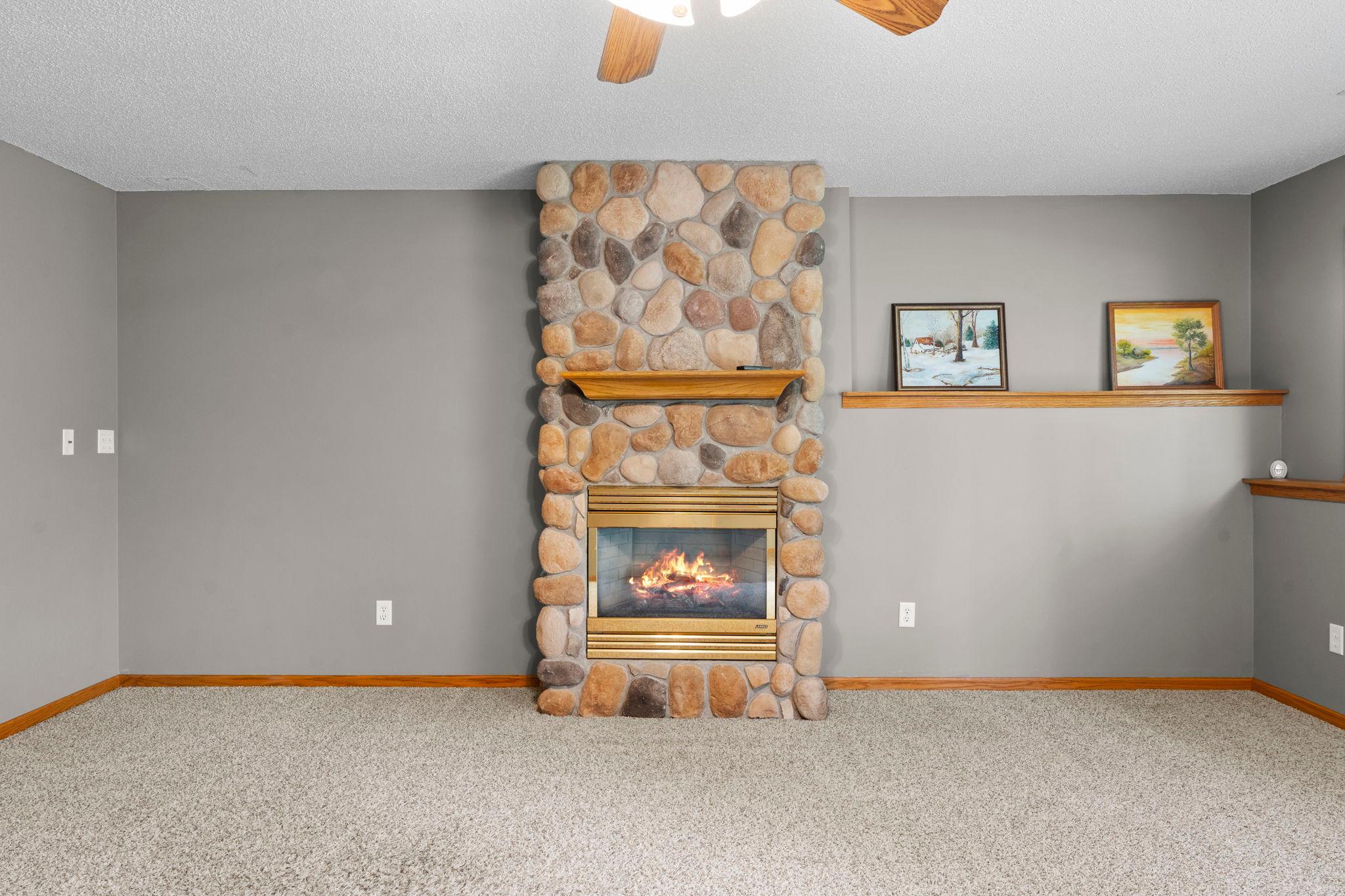 Stone gas fireplace in family room